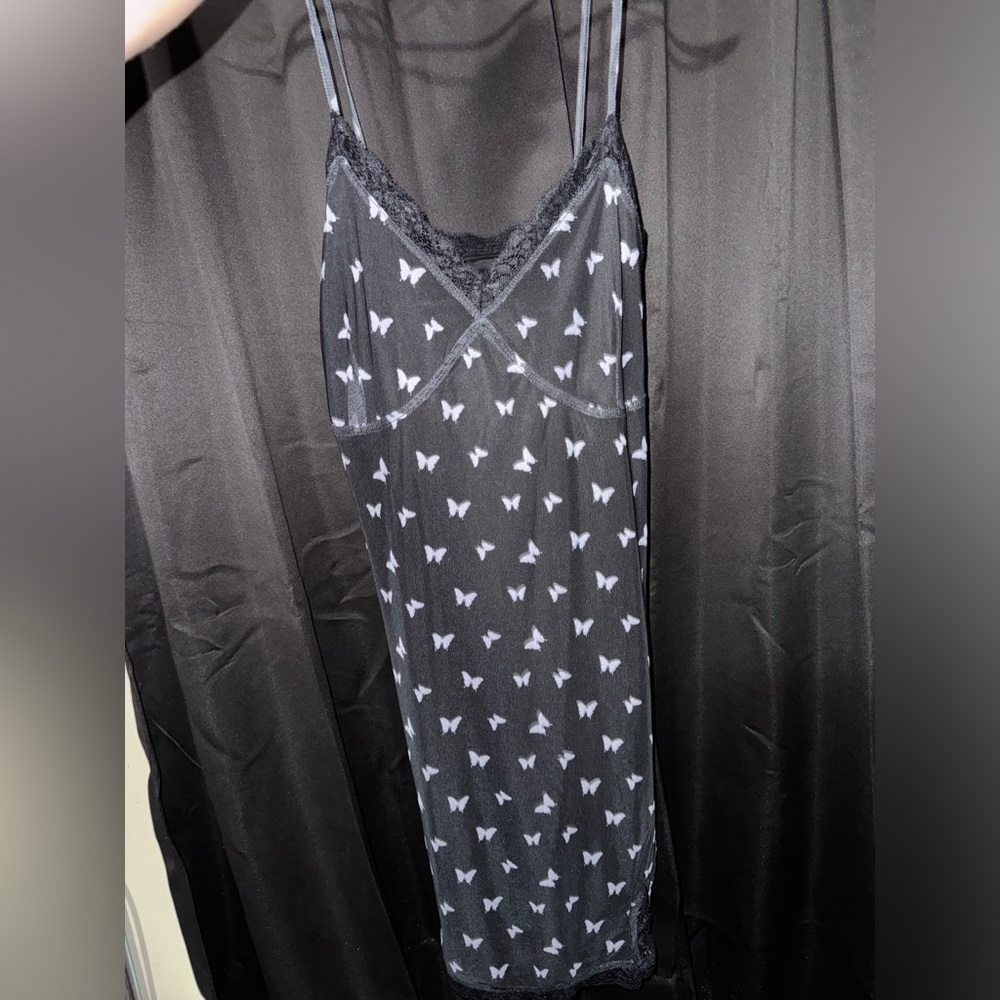 little black sleeveless butterfly dress